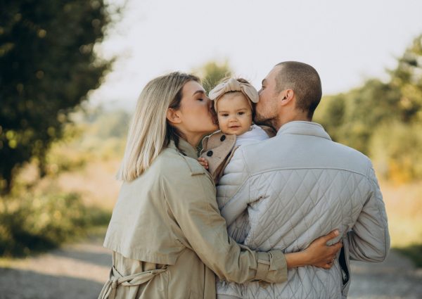 family-with-little-daughter-spending-time-together-sunny-field