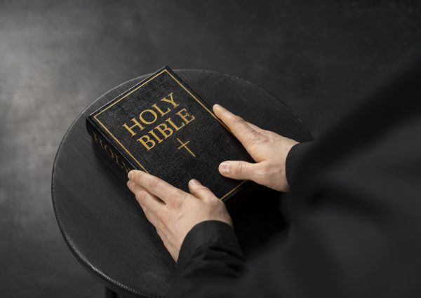 hands-holding-holy-bible-close-up